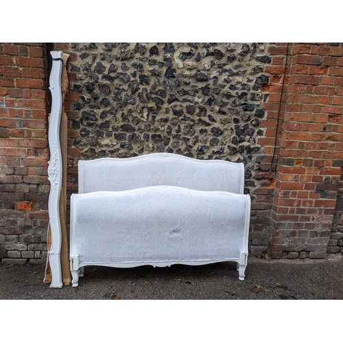 431 - A white painted and upholstered double bed head and foot board with side rails, 150cm w Location: G