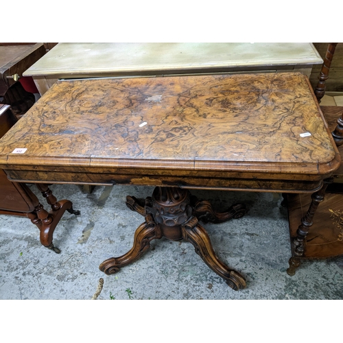 432 - An early Victorian walnut pedestal card table, swivel and fold over top with circular inset baize, o... 