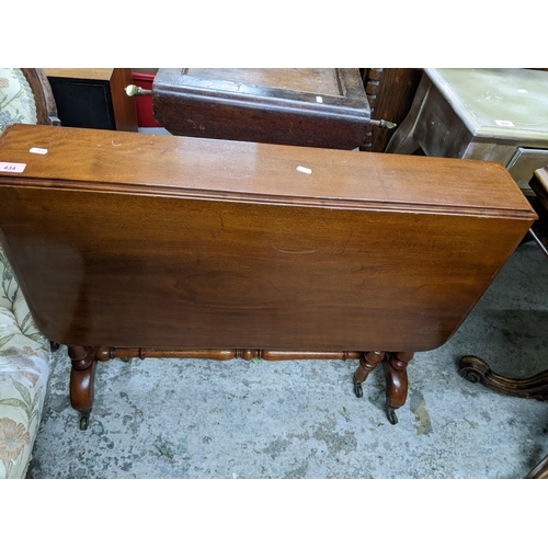 434 - Victorian mahogany Sutherland table on turned columns and legs, brass castors 72cm x 90.5cm x 6.5cm ... 