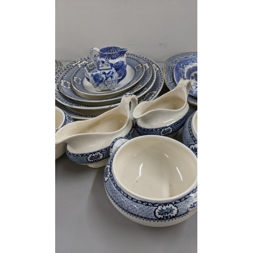 438 - A mixed lot of blue and white ceramics to include various serving plates, dinner and side plates, a ... 