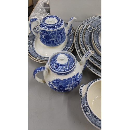 438 - A mixed lot of blue and white ceramics to include various serving plates, dinner and side plates, a ... 