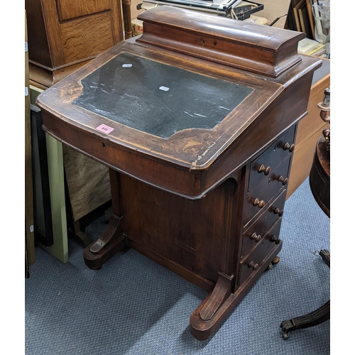 449 - A late Victorian walnut Davenport having a fitted interior and four drawers to one side 81cm h x 53c... 