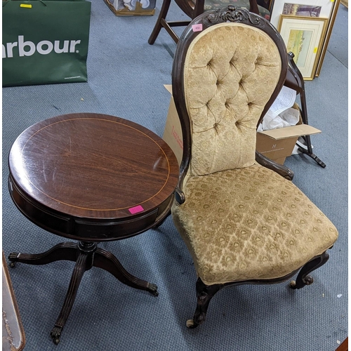 450 - A Victorian mahogany spoon back nursing chair, together with a reproduction mahogany drum table Loca... 