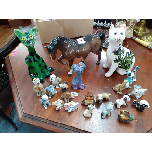 478 - A Baron Barnstaple green glazed pottery model of a cat, a Beswick mare, a G. Hill pottery cat and a ... 