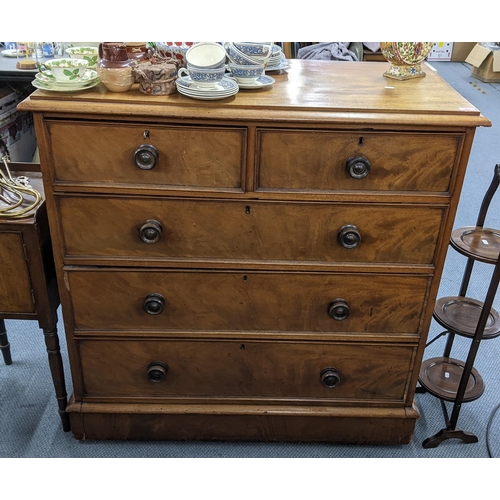 481 - A 19th century walnut chest of two short and three long drawers having turned handles and on a plint... 