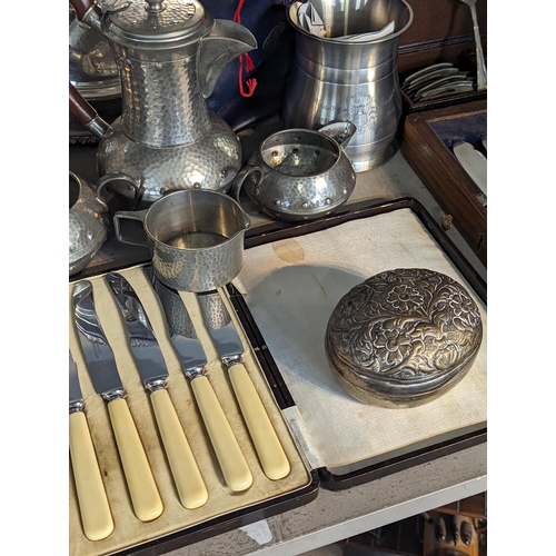 486 - Mixed metalware to include Roundhead pewter hammered teapot and companions, silver plate and other b... 