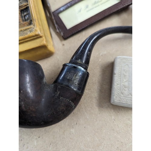 492 - A mixed lot of interest to include smoking pipes, cheroot holder, whistle and others along with boxe... 