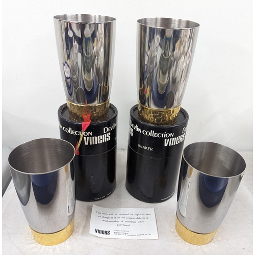 495 - Stuart Devlin for Viners, a group of four stainless steel and gilt metal beakers, two with original ... 