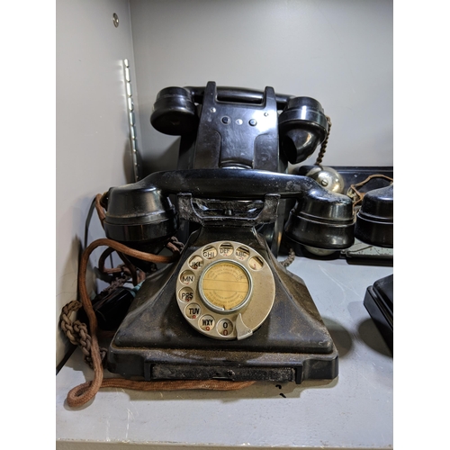 499 - A collection of vintage telephones including five vintage Bakelite telephones, one wall hanging phon... 