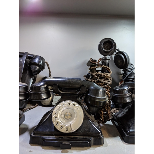 499 - A collection of vintage telephones including five vintage Bakelite telephones, one wall hanging phon... 