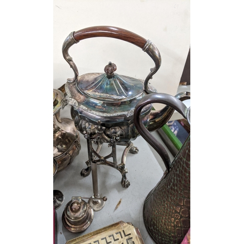 501 - A mixed lot to include a 19th century spirit kettle, silver plated teapot, a pair of goblets togethe... 