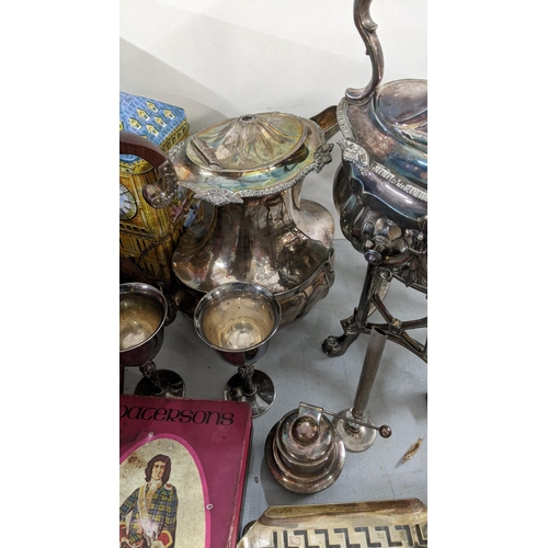 501 - A mixed lot to include a 19th century spirit kettle, silver plated teapot, a pair of goblets togethe... 