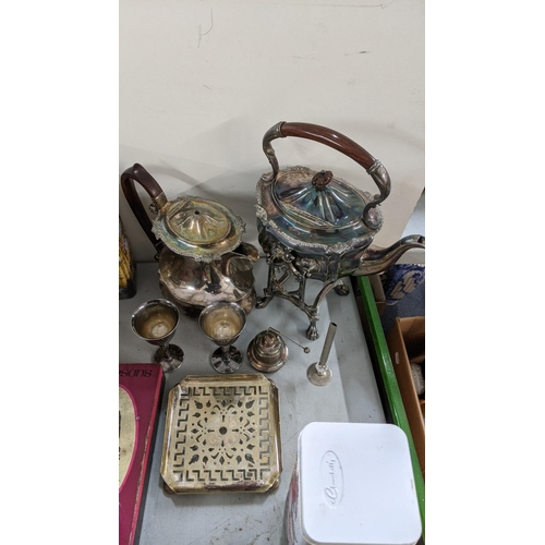 501 - A mixed lot to include a 19th century spirit kettle, silver plated teapot, a pair of goblets togethe... 