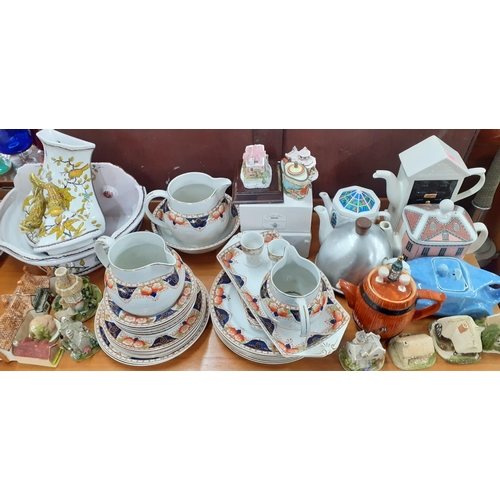 517 - Mixed teapots to include a Sadler lilac glazed racing car teapot and a miniature enamelled example t... 