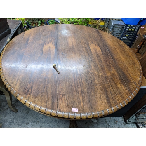 433 - A Regency/early Victorian rosewood tilt top breakfast table, circular top with dentil moulded edge r... 