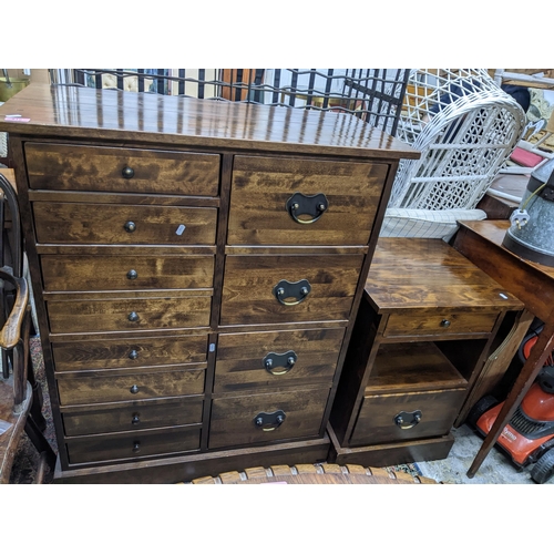 519 - A Laura Ashley chest of drawers and matching bedside chest, the chest of drawers with eight short dr... 