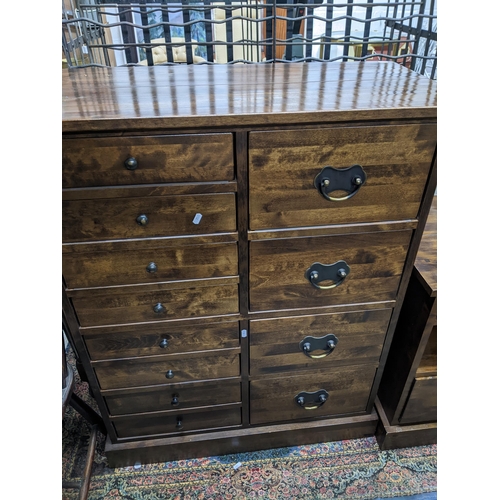 519 - A Laura Ashley chest of drawers and matching bedside chest, the chest of drawers with eight short dr... 