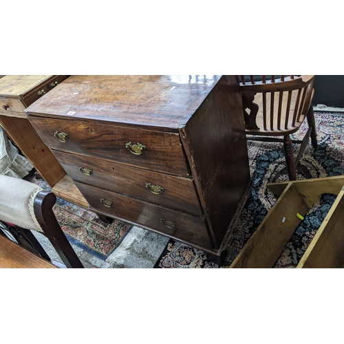 520 - A Georgian mahogany chest of small proportions, three long drawers with brass swan neck handles, on ... 