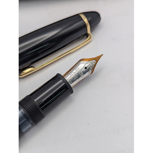 16A - A boxed Montblanc Meisterstück Classic fountain pen, engraved 