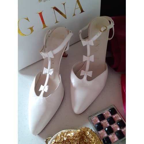 60 - Gina-A pair of white shoes with kitten heels and three bow design, UK size with original branded sho... 