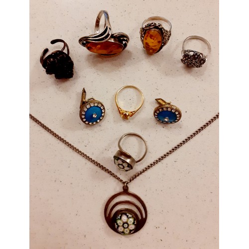 62 - Two silver and amber Modernist rings, a silver marcasite ring, a silver pendant with micro-mosaic in... 