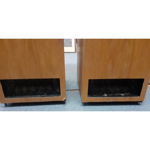 180 - A late 20th/early 21st Century pair of tall speakers in a light oak casing, 90