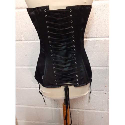 84 - A Vollers bespoke black satin corset with original box, adjustable sizing from 32