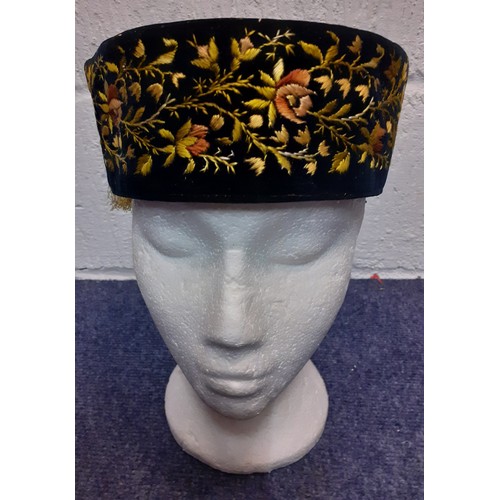 55 - A late 19th/early 20th Century hand-sewn black velvet smoking cap with yellow embroidered floral fri... 