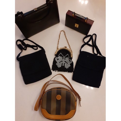 88 - A small group of vintage bags to include a 1980's Fendi shoulder bag with striped design canvas and ... 