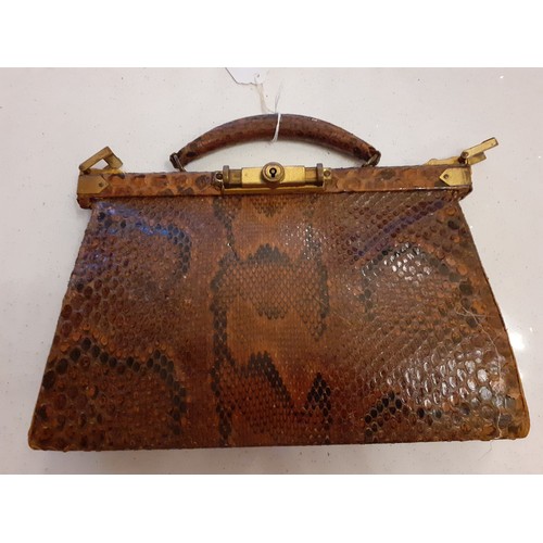 113 - A mixed lot comprising a vintage brown snakeskin handbag with mirror and purse, 2 vintage compacts, ... 