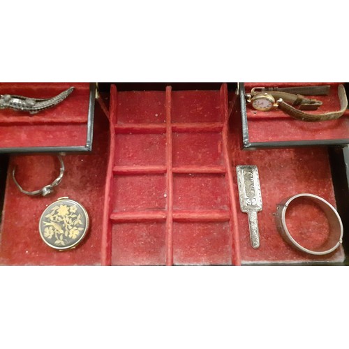 143 - A large black leather jewellery chest containing a group of vintage necklaces to include a multi-str... 