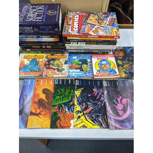 250 - Books-A group of science fiction books and ceramics to include The Encyclopaedia of science fiction,... 