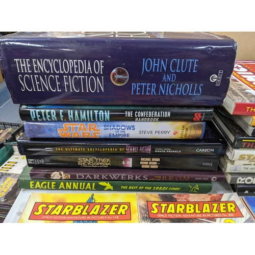 250 - Books-A group of science fiction books and ceramics to include The Encyclopaedia of science fiction,... 