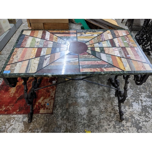 338 - A 20th century hardstone specimen coffee table, rectangular top on a cast iron framed base, 71 x 96 ... 