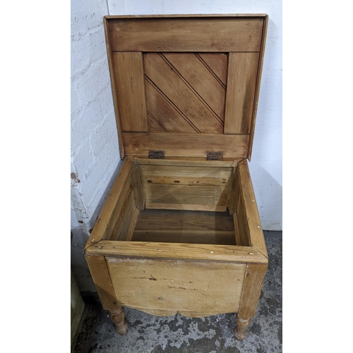 342 - A late 19th /early 20th century pine box, hinged lid, twin brass carrying handles, shaped apron, on ... 