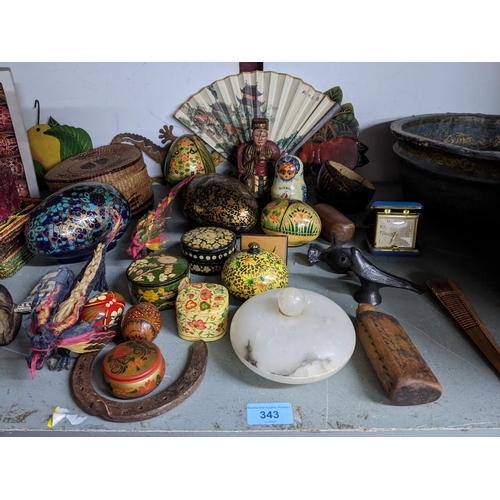 343 - A mixed lot of wooden and other items to include Russian dolls, paper mache boxes and East European ... 