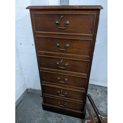 351 - A reproduction mahogany six drawer filing cabinet with insert gilt tooled green leather top, on plin... 