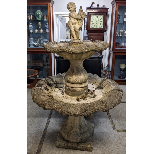 A large weathered cast stoneware fountain having a cherub to the top above two graduated shell shaped bowls raised on a squared framed base 176hx113w
Location: FOYER