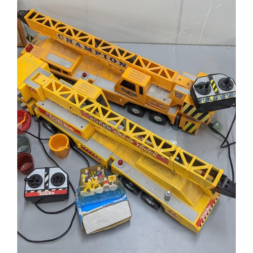 83 - A Tonka 3201 Super Crane Truck with operating remote, together with a similar one and other items
Lo... 