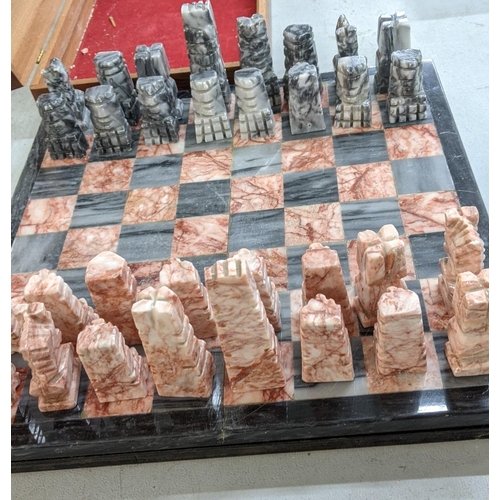 93 - A marble chess board having carved chess pieces
Location:FSR