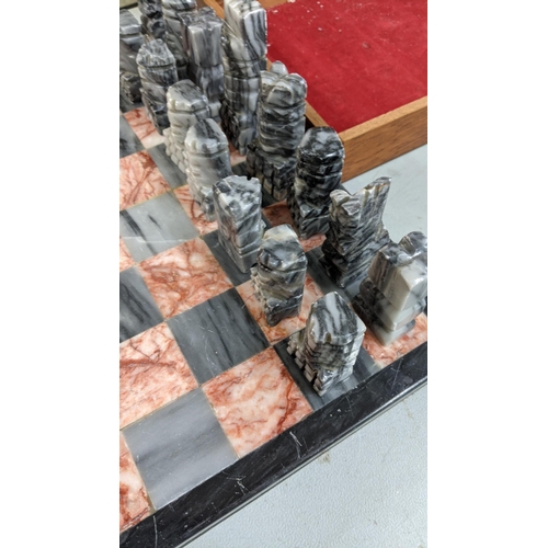 93 - A marble chess board having carved chess pieces
Location:FSR