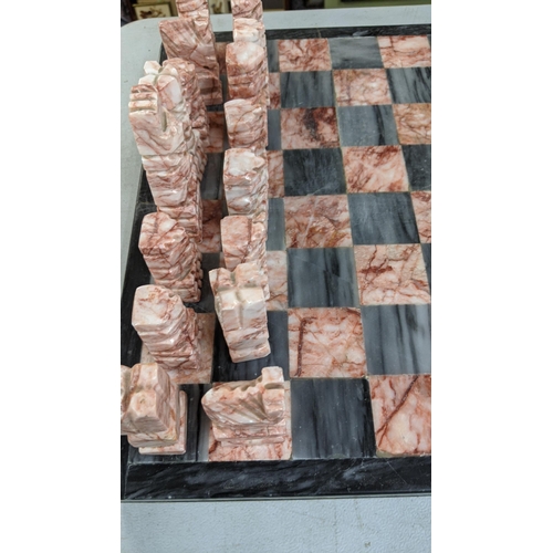 93 - A marble chess board having carved chess pieces
Location:FSR