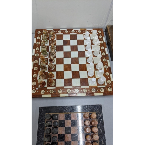 93 - A marble chess board having carved chess pieces
Location:FSR