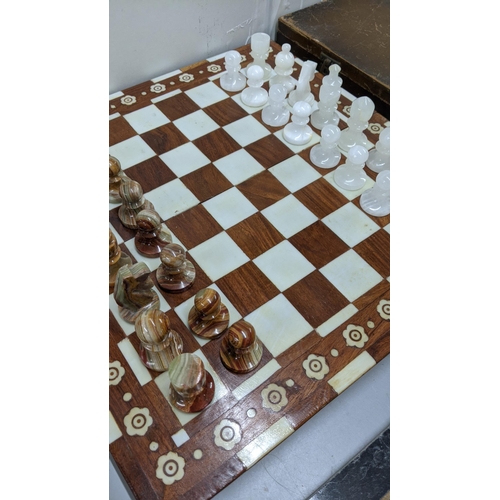 93 - A marble chess board having carved chess pieces
Location:FSR