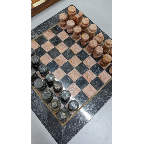 93 - A marble chess board having carved chess pieces
Location:FSR