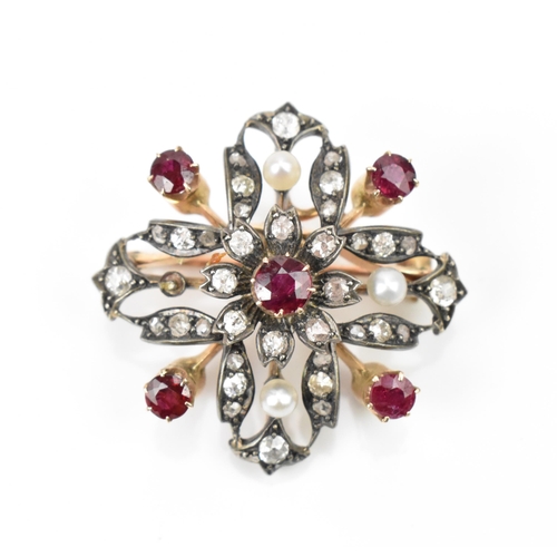 An Edwardian diamond and ruby encrusted brooch, set in rose metal and white metal, forming a stylised cross with central floral cluster, set with old cut diamonds, three seed pearls, and five rubies, the central round cut ruby in an eight claw setting approx. 4.5mm diameter, with revolving catch, the brooch 3.2 cm wide
Location:CAB1