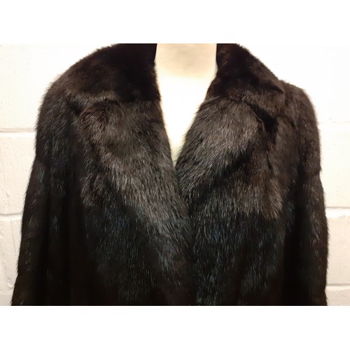 159 - A late 20th Century black rabbit fur coat 42