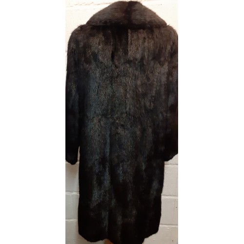 159 - A late 20th Century black rabbit fur coat 42