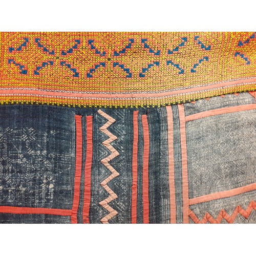 227 - A hand woven tribal blanket/throw/wall covering having sections of yellow, blue, pink and orange pat... 