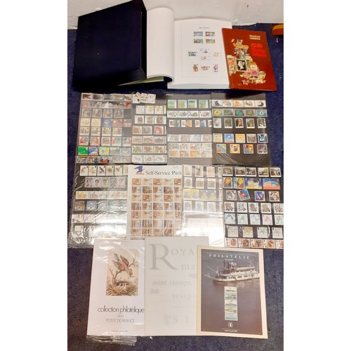 253 - A stamp collection comprising a Queen Elizabeth II album of 1950's and later British stamps, an empt... 